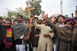 PESHAWAR, PAKISTAN - MAR 16: Christian Community chant slogans against Twin blasts targeted the Roman Catholic Church and Christ Church in Youhanabad area of Lahore on March 16, 2015 in Peshawar.